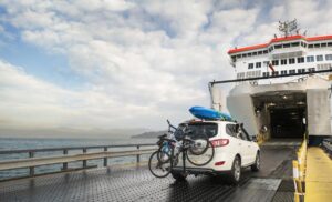 Traveler preparing an essentials bag before boarding a vehicle ferry