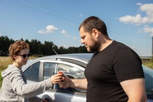 Travelers preparing to share driving during a New Zealand road trip